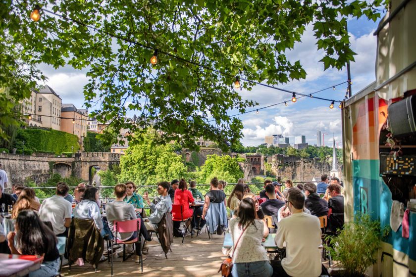 Luxembourg City with seating area and urban surroundings